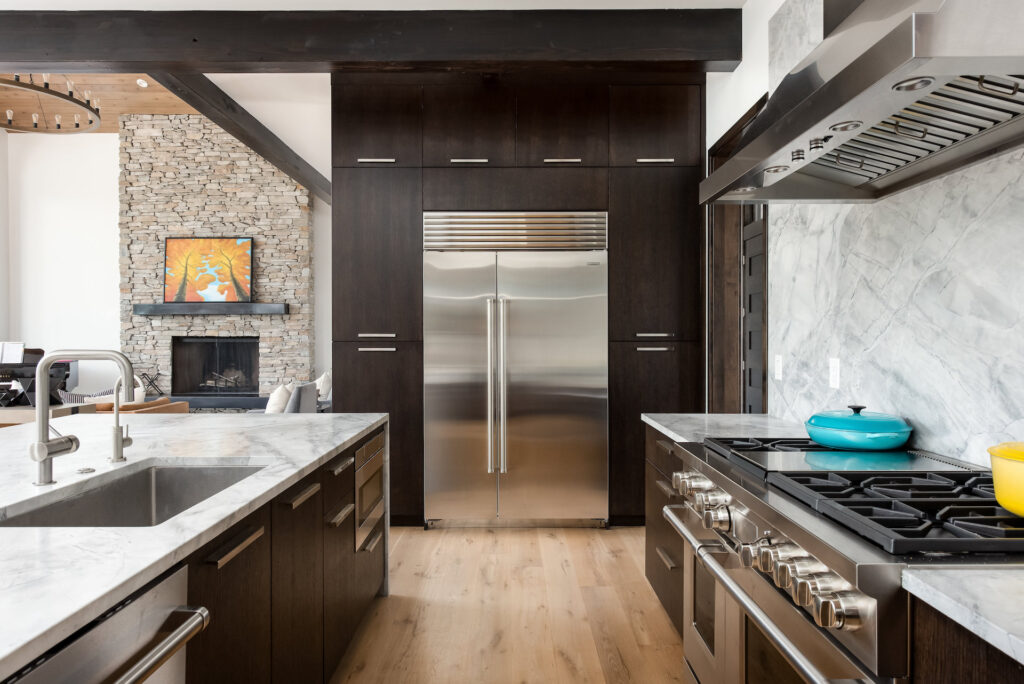 modern walnut kitchen cabinets with stainless steel appliances