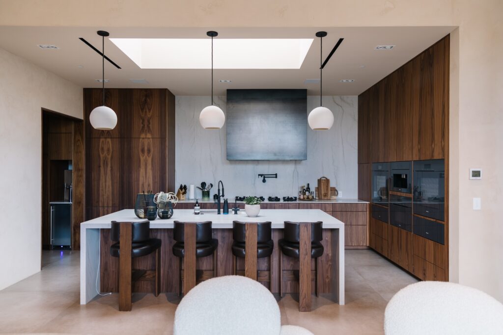 organic modern kitchen with slab walnut custom cabinetry